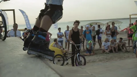 Young Athlete Demonstrates Rollerskating on a ramp during the competition. Slow Stock Footage 60681683
