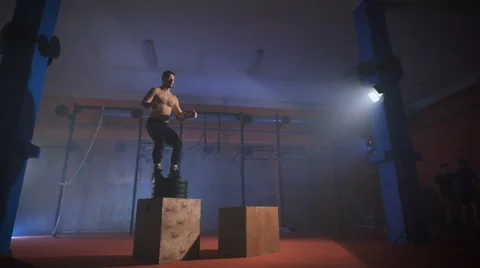 Young athlete doing crossfit exercise jump Video stock 68653334