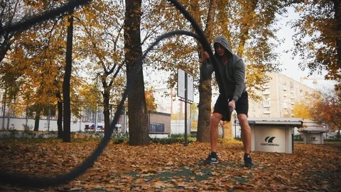 Young athlete doing exercise with battle ropes Stock Footage 96771503