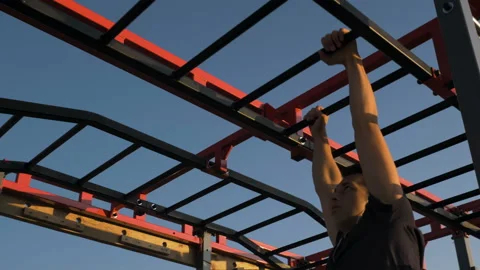 Young athlete doing exercises on the bar and stairs Stock Footage 122848162