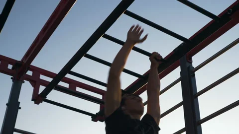 Young athlete doing exercises on the bar and stairs Stock-Footage 122850516