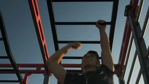 Young athlete doing exercises on the bar and stairs Stock Footage 122853771