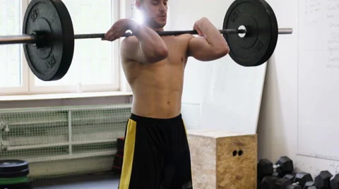 Young athlete doing Hang power clean exercise at gym Stock Footage 65280158