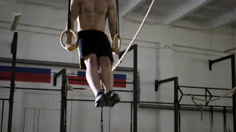 Young athlete doing muscle up exercise at the gym Stock Footage 65280167