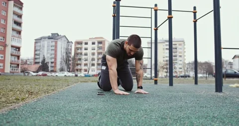 Young athlete doing one hand push ups Stock Footage 145348141