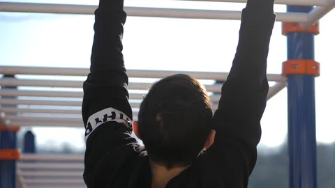 Young athlete doing warm up exercises before training Stock Footage 125810166