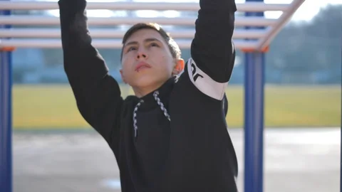 Young athlete doing warm up exercises before training Stock Footage 125811421