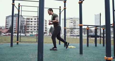 Young athlete exercising and doing lunge outdoor Stock Footage 145348094