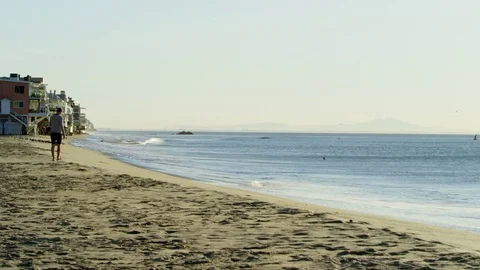 Young athlete is going to do exercises on a beach Stock Footage 77679823