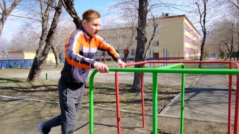 Young athlete makes jumping over obstacles Stock Footage 128698812