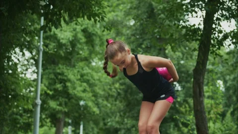 A Young Athlete Perfects Her Technique in a Serene Outdoor Environment 스톡 동영상 314223371