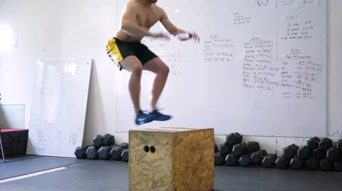 Young athlete performing box jump exercise at gym Stock Footage 65280190