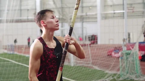 Young athlete preparing for a pole vault jump Stock Footage 318466014