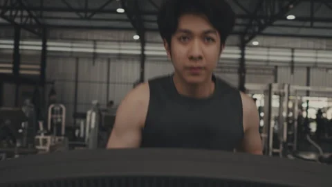 Young Athlete Running on Treadmill before Intense Gym Session, Muscular Young Stock Footage 248848815