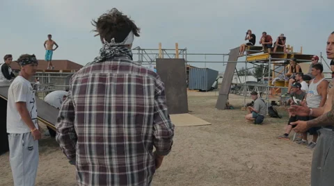 Young Athlete Trains Elements of Parkour using training wall at the seashore Stock Footage 60687956