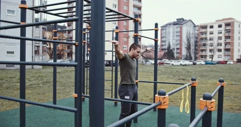 Young athlete warming up and checking smartwatch Stock Footage 145347979