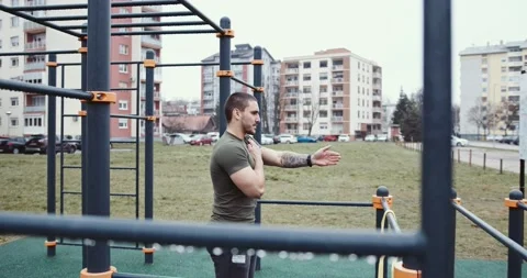 Young athlete warming up for a training , outdoor fitness Stock Footage 145347713