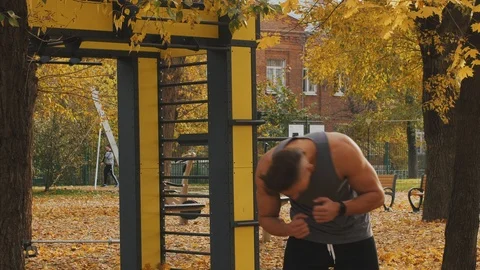 Young athlete warming up before training tilting the body Stock Footage 96885308