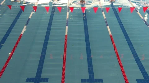 Young athletes compete in clear blue water. Stock Footage 101203216