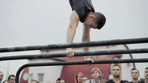 Young athletes show acrobatic stunts on the crossbar Stock Footage 170065854