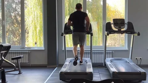Young athletic athlete doing cardio on the treadmill Stock Footage 219747415