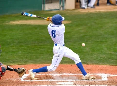 Young athletic boys playing baseball Stock Photos