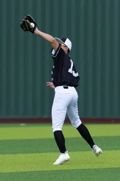 Young athletic boys playing baseball Stock Photos