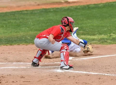 Young athletic boys playing baseball Stock Photos