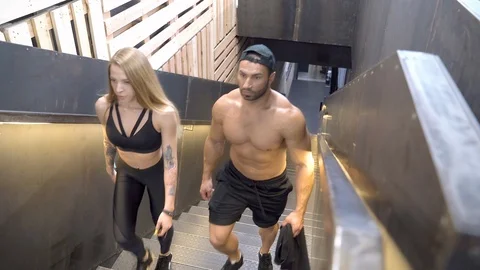 Young athletic couple going for a workout in the gym Stock Footage 109118775