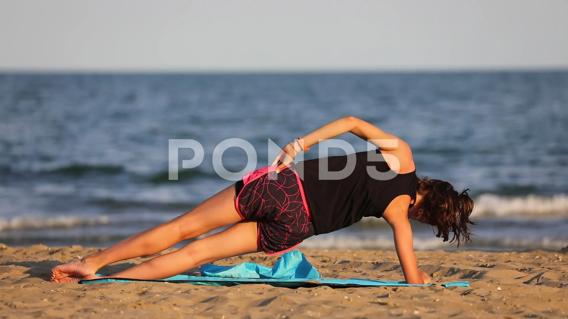 Women's yoga. Athletic young woman performs a yoga exercise