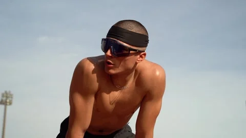 Young athletic guy exhausted after a hard workout, rests on his knees sweat.. Stock Footage 267894504