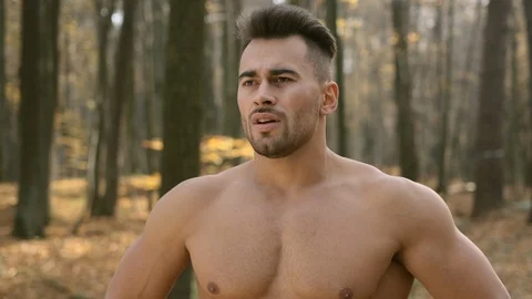 Young Athletic Guy With Naked Torso Stands In The Woods And Does Breathing Stock Footage 120651401