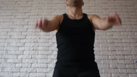 Young athletic man in a black T-shirt doing squats. Bottom view. Sport and Stock Footage 102600721