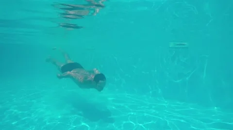 Young athletic man diving in blue swimming pool 스톡 동영상 68320508