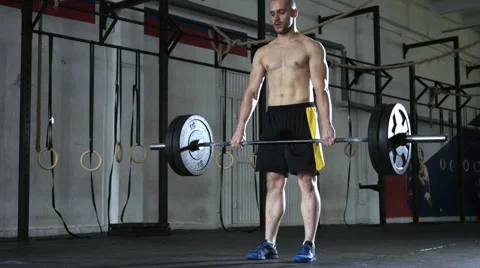 Young athletic man doing deadlift exercise at the gym. Stock Footage 65280233