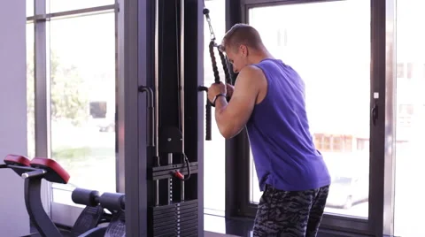 Young athletic man doing pulldown exercise Video stock 67462315