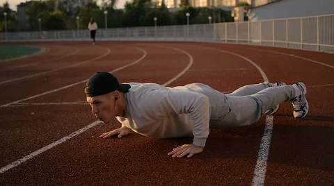 Young athletic man doing warm-up before exercise and jogging 스톡 동영상 64020600