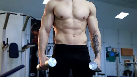 Young athletic man execute  muscle exercises Stock Footage 74113913