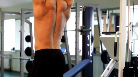 Young athletic man execute  muscle exercises Stock Footage 74113921