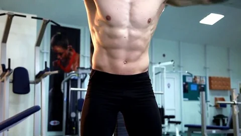 Young athletic man execute  muscle exercises Stock Footage 74113928