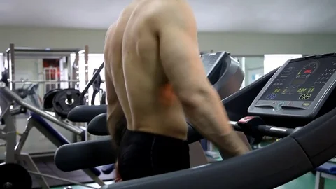 Young athletic man execute  muscle exercises Stock Footage 74295314