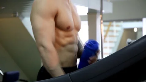 Young athletic man execute  muscle exercises Stock Footage 74295319