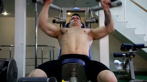 Young athletic man execute  muscle exercises Stock Footage 74295321