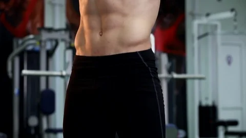 Young athletic man execute  muscle exercises Stock Footage 74295332