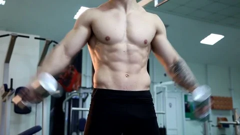 Young athletic man execute  muscle exercises Stock Footage 74404994