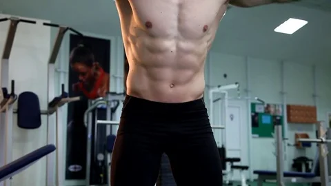 Young athletic man execute  muscle exercises Stock Footage 74404999