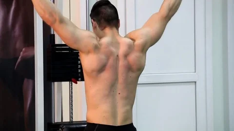 Young athletic man execute  muscle exercises Stock Footage 74405002