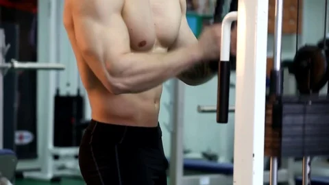 Young athletic man execute  muscle exercises Stock Footage 74405003