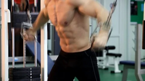 Young athletic man execute  muscle exercises Stock Footage 74405007