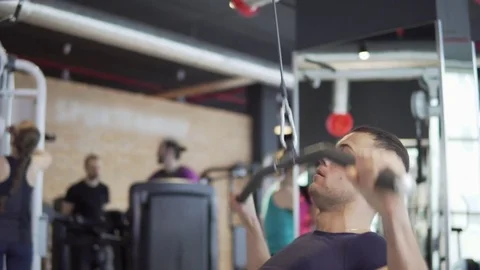 Young athletic man is exercising in the gym Stock Footage 73777603